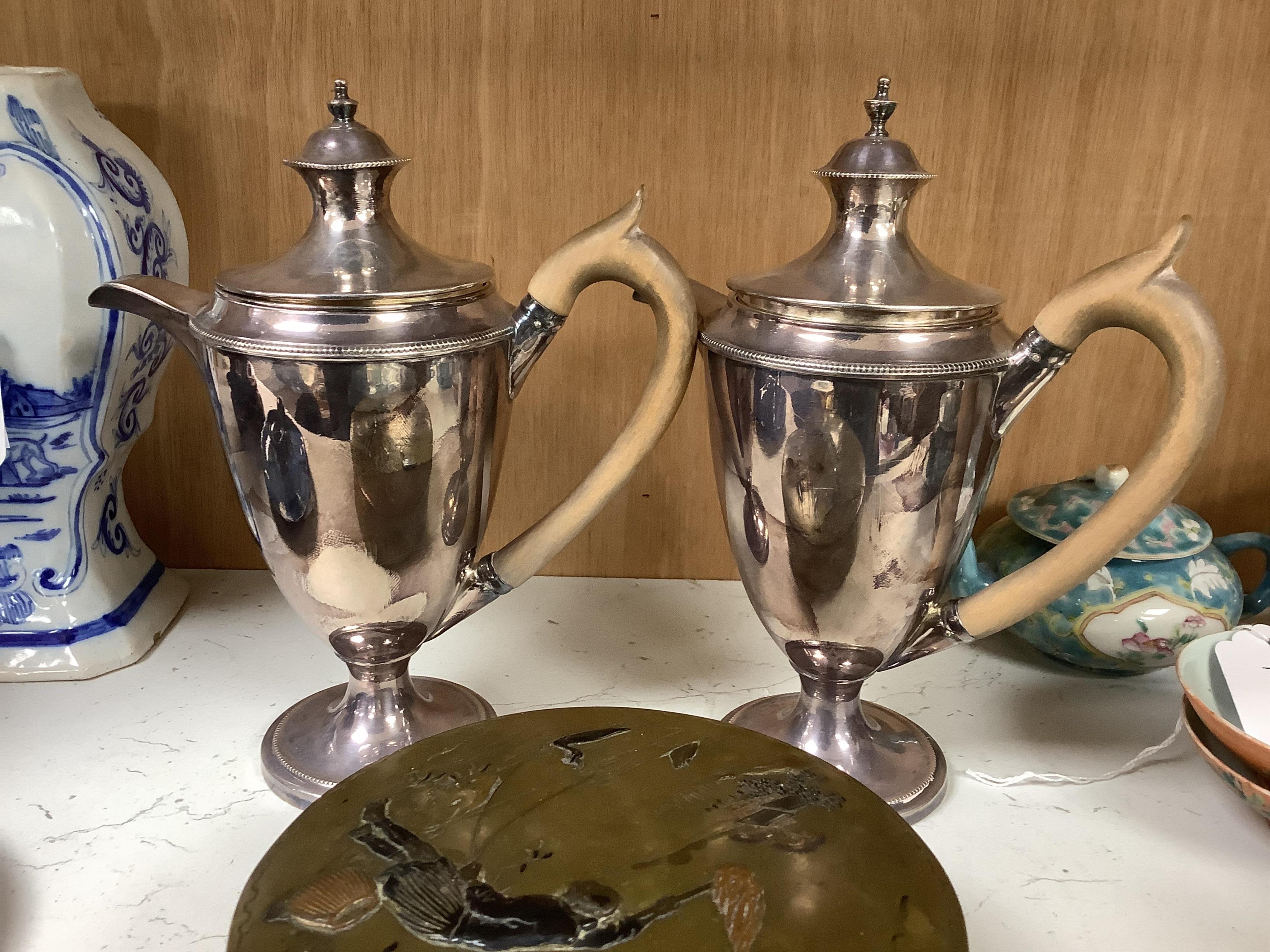 A Japanese bronze and mixed metal mounted box and cover, Meiji period, 13.5cm diameter. Together with a pair of plated jugs Condition - fair to good